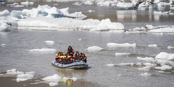 Excursion boat on the ice lagoon Fjallsarlon