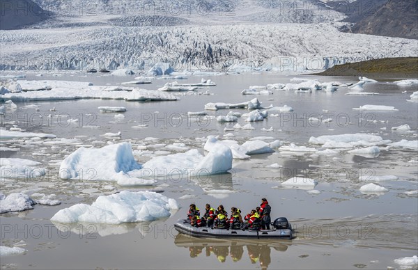 Excursion boat on the ice lagoon Fjallsarlon