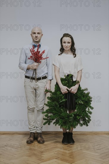 Man and woman with fir wreath