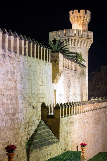 Fortress wall with watchtower at night