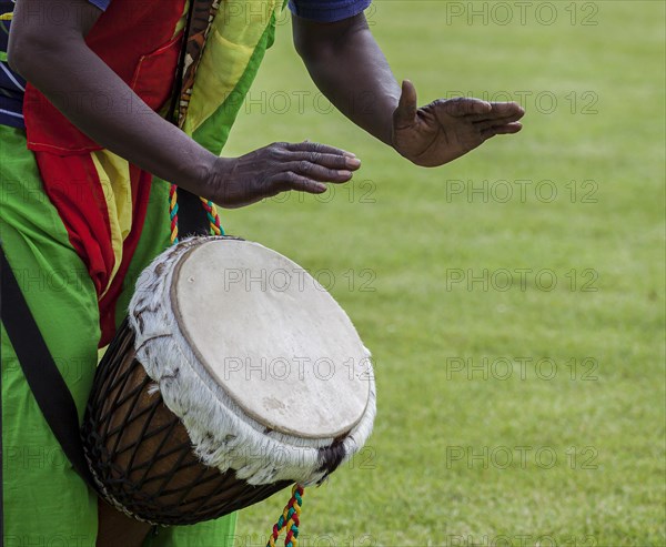 Musicians playing on an African djembe