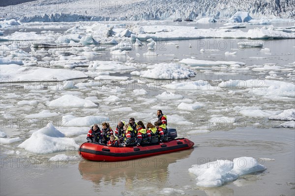 Excursion boat on the ice lagoon Fjallsarlon