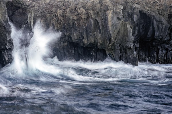 Surf at rocky lava coast