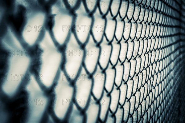 Wire mesh fence with ice