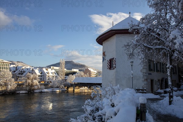 Objective tower and wooden bridge over the Aare