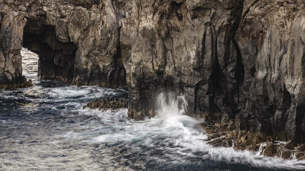 Surf at rocky lava coast