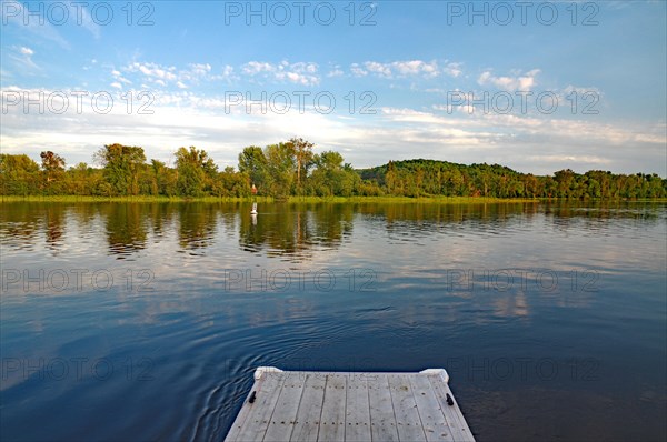 Wooden footbridge by a lake