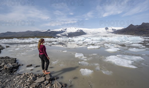 Woman in front of Fjallsarlon ice lagoon