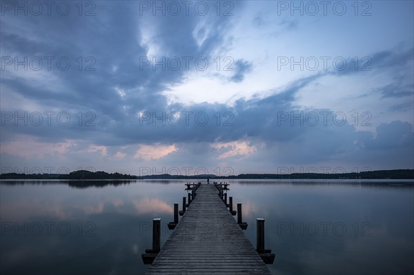Footbridge into the Woerthsee shortly in front of sunrise