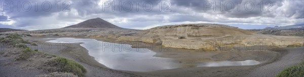 Sandstone structures and behind them the mountain Montana Roja