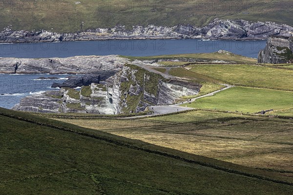 View of meadows and cliffs from Coomanaspig Pass