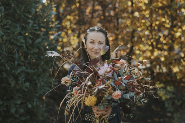 Woman with autumnal bouquet