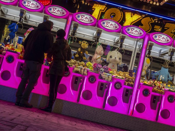 Colourfully illuminated slot machines at a fair