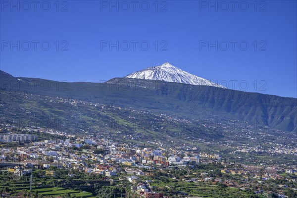 View over the town to the snow-capped Teide