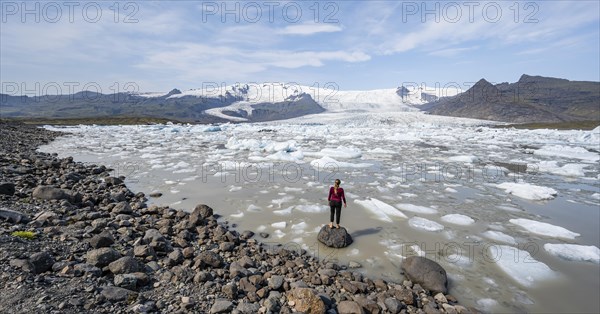 Woman in front of Fjallsarlon ice lagoon