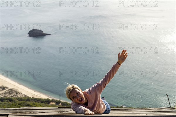 Woman falling from the high into the ocean