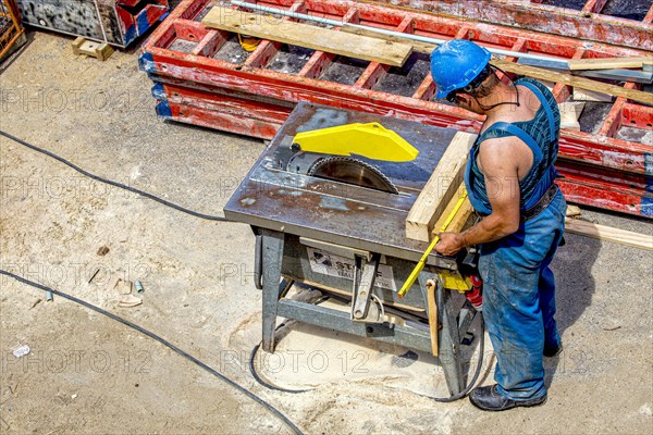 Craftsman working on a circular saw