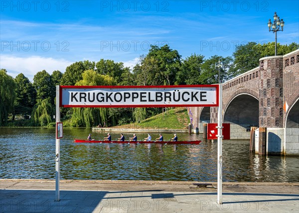 Recreational sportsmen in a rowing boat at the Krugkoppelbruecke