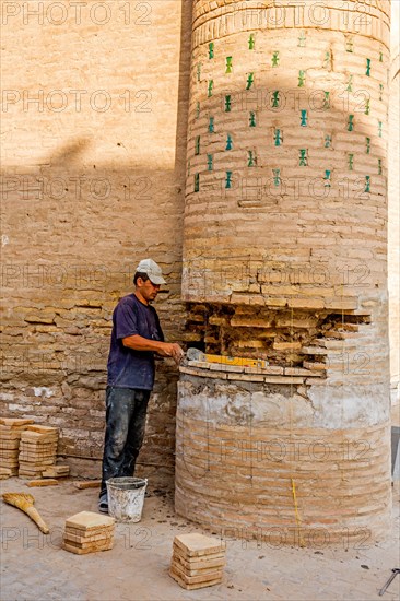 Renovation work on mud bricks