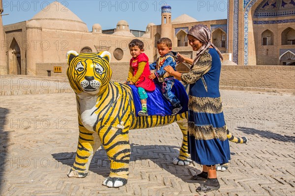 For the photographer in front of the medrese Kutluq Marad Inaq