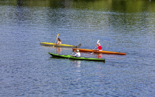 Recreational sportsmen with their kayak on the Havel