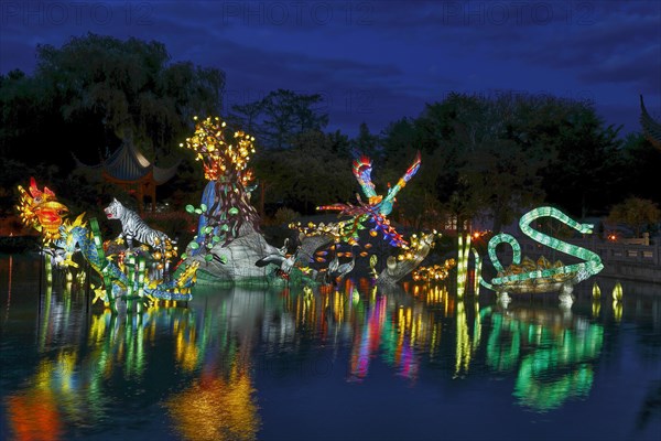 Illuminated figures at the Chinese Garden