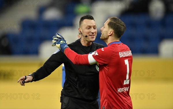 Referee Sven Jablonski in conversation Discussion with goalkeeper Oliver Baumann TSG 1899 Hoffenheim