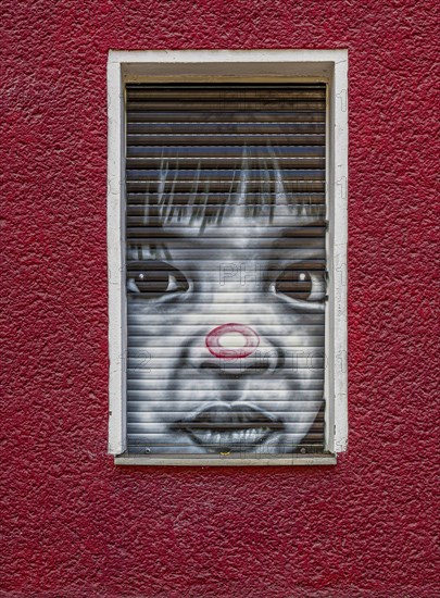 Creative graffiti with emotional statements on the facade of a youth psychiatrist's house