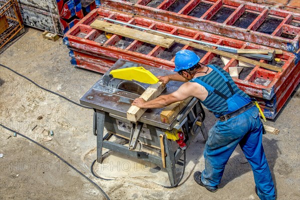 Craftsman working on a circular saw