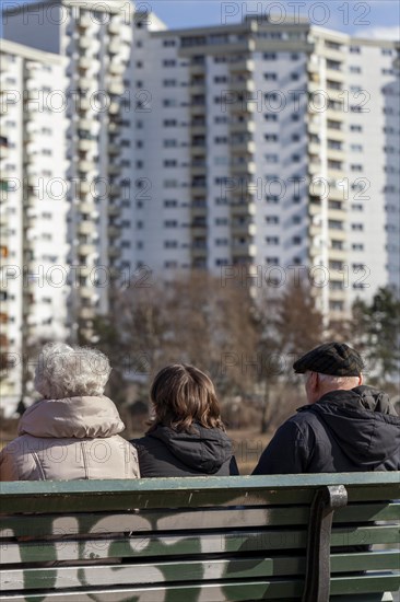 Seniors sitting on a park bench at the Segeluchbecken in the Maerkisches Viertel