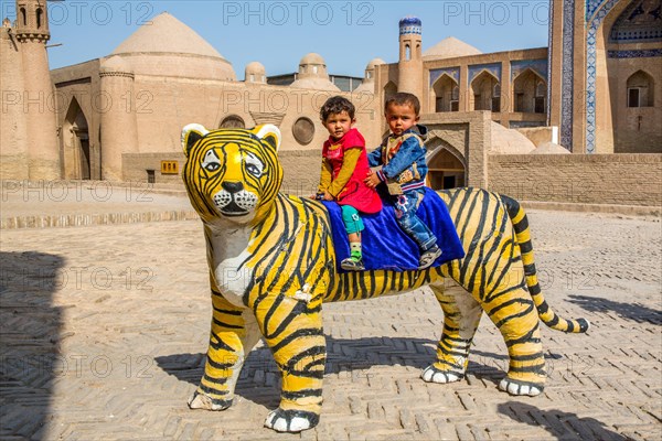 For the photographer in front of the medrese Kutluq Marad Inaq