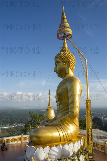 small golden pagoda on the temple hill in the evening