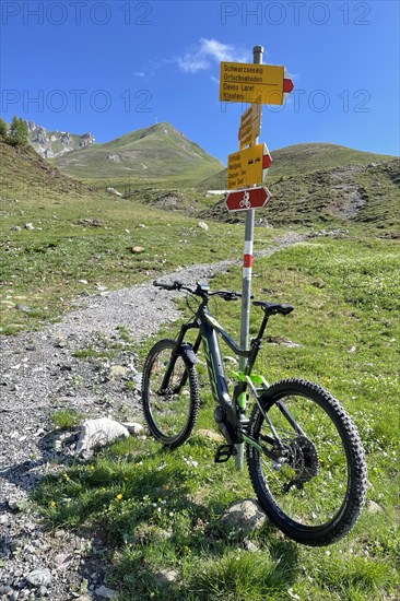 E Bike at hiking signpost