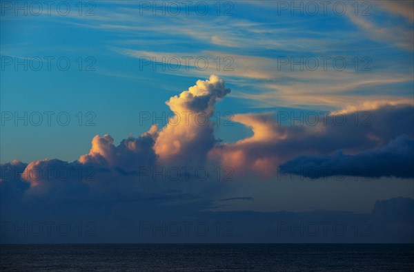 Sunset with clouds on the beach of Praia de Santa Barbara