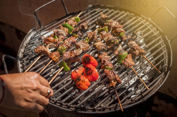 Roast beef skewers on a grill