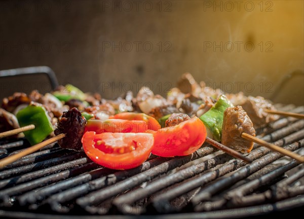 Roast beef skewers on a grill