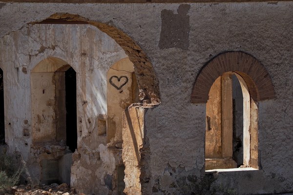 Abandoned house with round arches