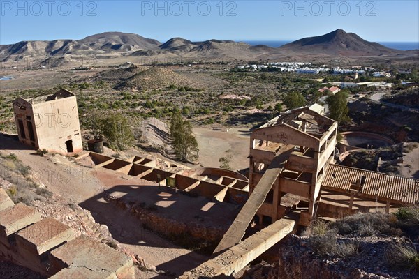 Former gold mine with ruins and round sinks by the sea