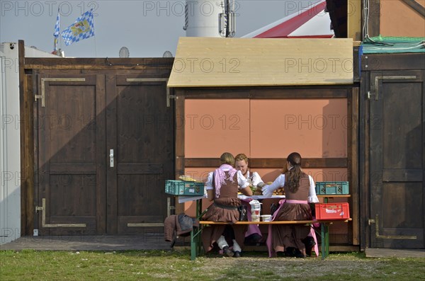 Waiter from beer tent makes snack