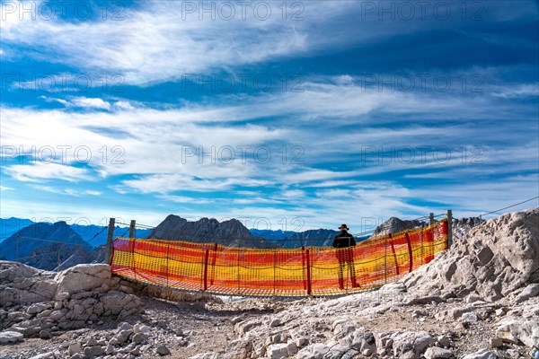 Small suspension bridge with red and yellow safety net on the Zugspitze