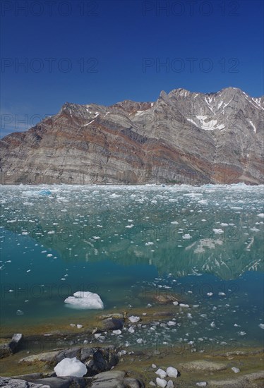 View of a fjord filled with drift ice