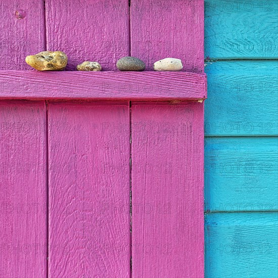 Four discarded stones on a beam