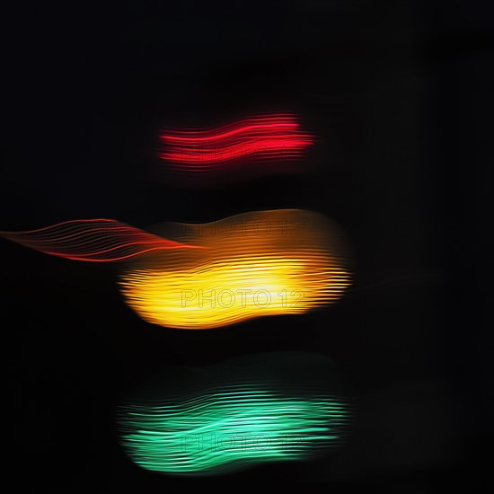 Lights of a traffic light in the dark