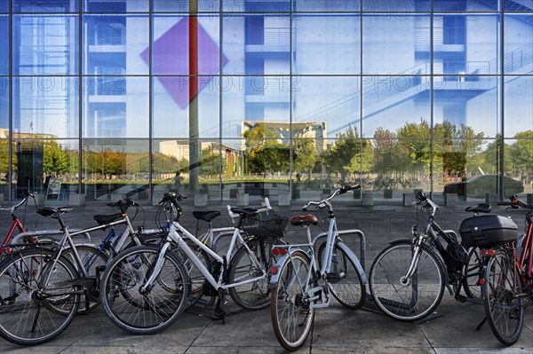 Bicycles in front of Paul-Loebe Parliament building along the Spree river