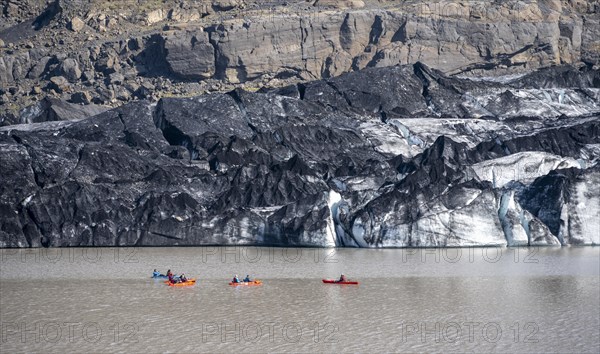 Kayaker on glacial lake