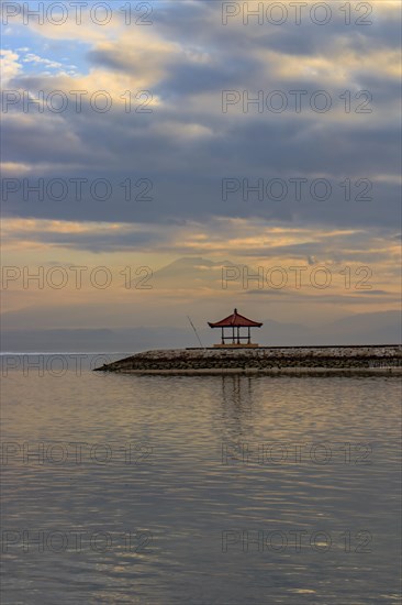 Beach with temple in the water at sunrise