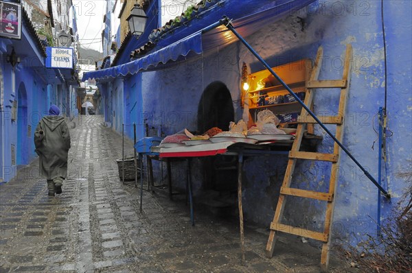 Alley with blue houses