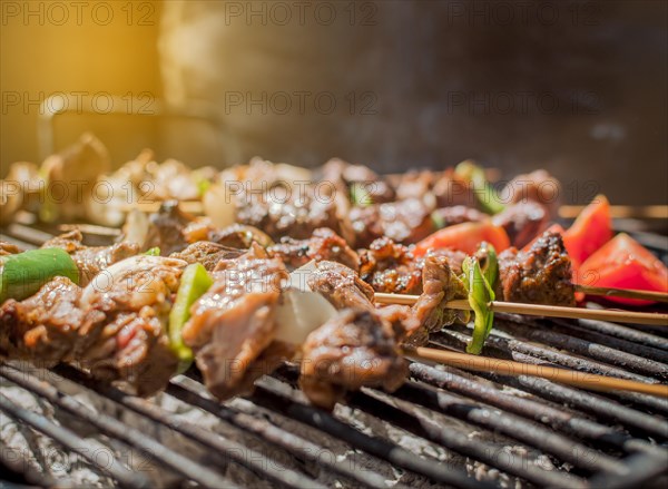 Roast beef skewers on a grill