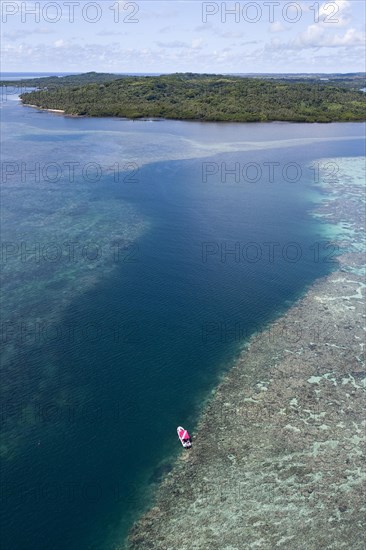 Sea level rising above reef top in tidal current channel