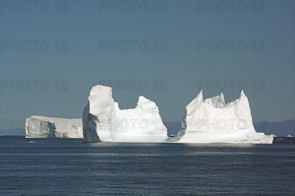 Huge icebergs in a wide bay